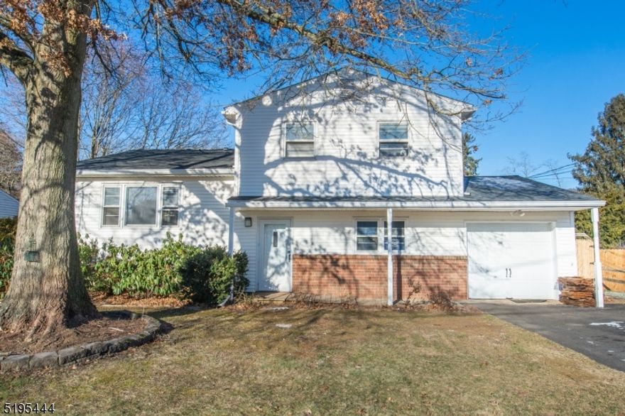 Spacious College View oversized split colonial in desirable area with newer addition and potential for 5 or 6 bedrooms! Entry level features slate foyer, powder room, office or bedroom and potential for 6th bedroom with handicapped access full bath/roll-in shower and family room with wood burning fireplace & heatolator fan.  Could potentially become in-law suite with 2 rooms and full bath with separate entrance from rear yard.  Open floor plan on main level with hardwood and new vinyl plank flooring, entertainment sized dining room, eat-in kitchen with stainless appliances, breakfast bar, spacious living room and convenient laundry area. Upper level offers large primary bedroom suite with hardwood flooring, double closet and walk-in closet plus 3 additional bedrooms, full bath and attic storage access. Basement and crawlspace are unfinished, perfect for storage. Level and open fenced yard with gated access and storage shed. New vinyl plank flooring, natural gas and public utilities, new HVAC in 2021 with electronic air filter, 50 year roof new in 2022.  Fabulous location, minutes to shopping, dining, Centenary University, schools and highways.  A great place to make your HOME! Split HVAC in ground floor addition.