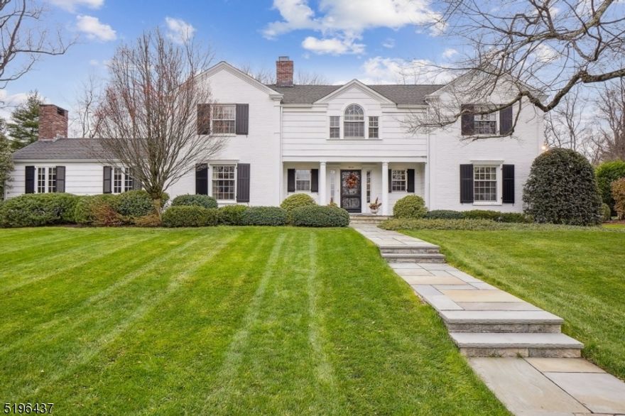 Classic Brick and Wood Shingle Colonial  sits on 1/2acre of manicured grounds.  Great location, walk to schools and downtown.  Four Bedrooms, 3 full and 2 half baths, Gourmet Kitchen with center island, high end appliances, desk area and wet bar with wine refrigerator. Sitting rooms on 1st & 2nd floors.  Fabulous screened porch for indoor/outdoor entertaining leads to level yard and patio.  Lower level includes Recreation Room, Exercise room ,powder rm and Laundry .  Charms galore