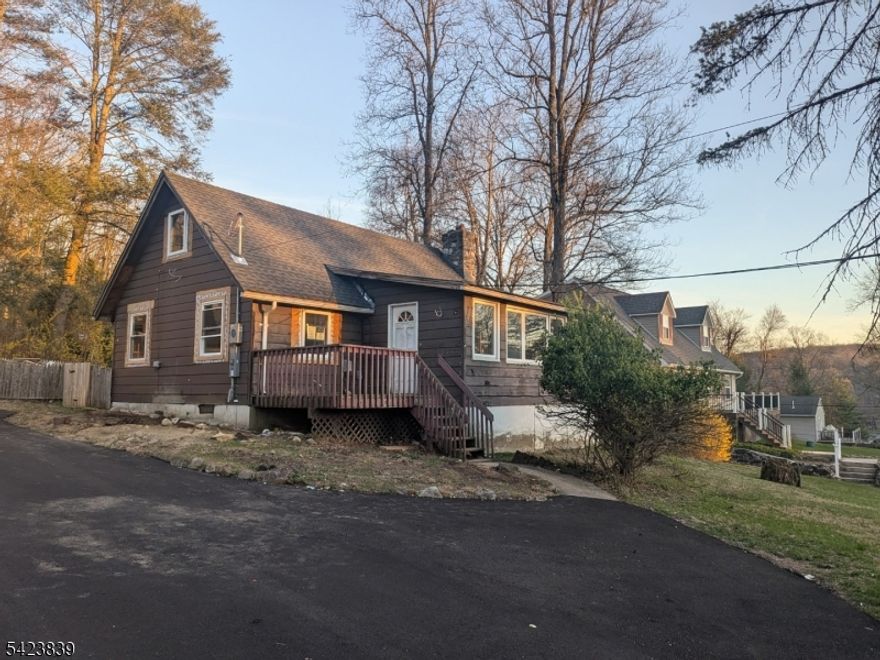 Attention builders and DIY enthusiasts! This 2 bed, 1 bath cape-cod located in the desirable Lake Wallkill community is ready for the finish line. Massive value has already been added with top-tier structural and mechanical upgrades. This home features; a brand new roof, high efficiency windows, all new electric & plumbing rough ins (fully inspected & approved by the municipality), plus a brand new custom interior stairway! Whether you're looking for a high-yield investment property or a customized primary residence, this cape cod offers the perfect head start. Sold as-is bring your tools and your imagination! HOA includes street snow removal on the street plus access to clubhouse and lake amenities.