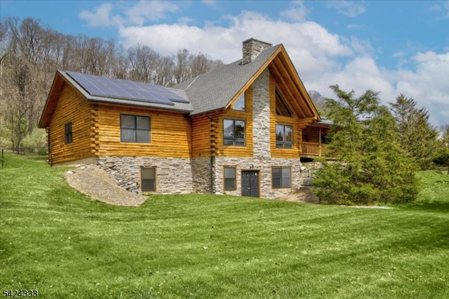 Magnificent log home with mountain views, exceptional privacy, and a 4-car garage complete with separate heat, A/C and electric. This property is perfect for hobbyists or anyone seeking space and seclusion. offering everything you expect in a log home with a few extras, this home features an open layout, exposed beams, cathedral ceilings, and abundant natural light. The main level includes both a primary suite and a princess suite, creating excellent situation for extended staying guests.  The walkout lower level offers two additional bedrooms, along with a spacious game room and family room. The fenced yard is ideal for entertaining, featuring a fire pit area and a concrete slab previously used for a hot tub, with electric already in place. Do not miss the walk-in pantry off the kitchen, two walk-in closets in the primary bedroom, and plumbing already installed in the 4-car garage for a future bathroom.This is a home you won't want to miss.