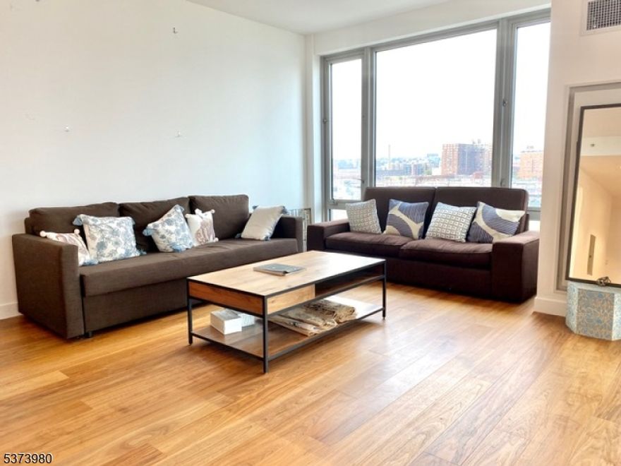 Located on Jersey City's Newport waterfront with all of the luxuries that one could ask for. This spacious 1458 square ft contemporary 2 bedroom home offers spectacular NYC/River view unfolding in front of its floor to ceiling windows. Hardwood floorings, walk-in closets with ample storage, adjustable central A/C and heat. Park and Shore offers over 20,000 Sq.ft of amenities including distinctive indoor heated lap pool, wine tasting lounge, co-working space, outdoor sky lounge, golf putting green and more. White Carrera marble kitchen countertops, Bosch appliances, Millwork and Venetian bronze trim, Walnut statue Woodflooring, Walnut vanity with Glacier White Quartz stone vanity top and white Begonia marble master bath. The Shore Club is a full-service building featuring 24 hr concierge, on-site super, exercise room, bike storage, and more. The Shore Club is close to shops, restaurants, supermarkets, Newport Green Park and much more. Minutes to Hoboken & Newport Path terminals.