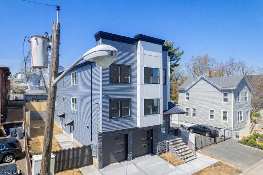 You found your dream home! Introducing a newly constructed two-family home in Irvington an exceptional opportunity for both owner-occupants and investors. Each unit features 4 spacious bedrooms and 2 full baths, including a primary suite with private bath and walk-in closet. Enjoy open-concept living and dining areas filled with natural light, and modern kitchens with quartz countertops and stainless steel appliances (stove, microwave, dishwasher). The finished lower level offers flexible bonus space ideal for a recreation room, home office, gym, or media area, plus a full bath, laundry area, and access to an oversized 2-car garage. Additional features include washer/dryer hookups on each floor and generous living space throughout. 5 year tax abatement benefit applies. Conveniently located near parks, restaurants, shopping and NYC transportation.