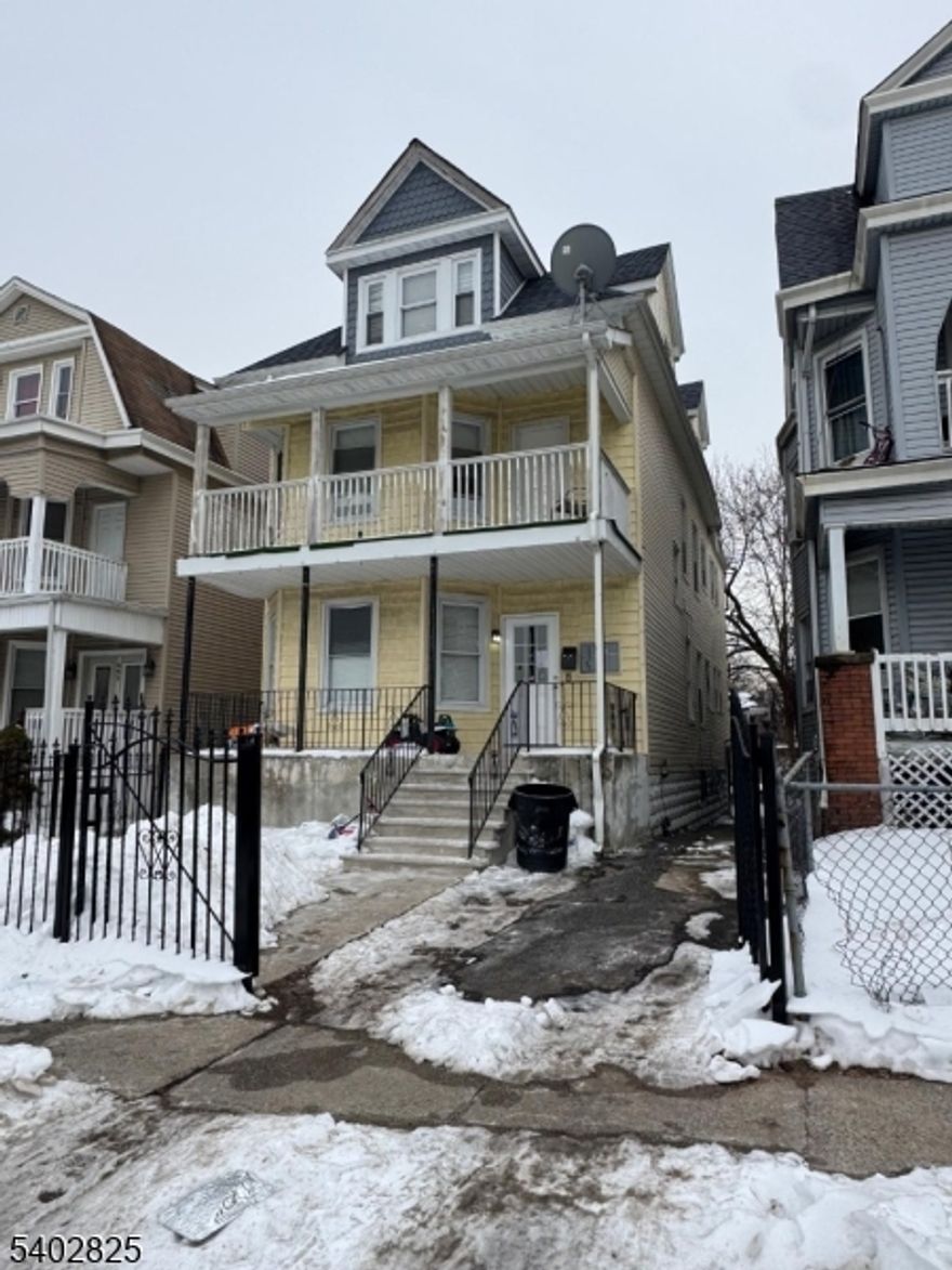 Recently Renovated - Three Family Home - Located in Front of Paul Robeson Staduim - near Garden State Parkway & Brick Train Station - Features Hardwood Floors, Central Air & Parking