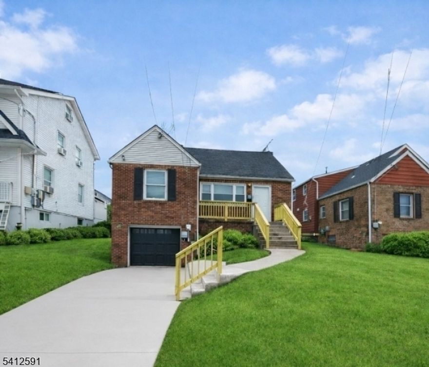 Updated home featuring newer kitchen with wood cabinetry, tile backsplash, tile flooring, and stainless steel appliances including gas range and built-in microwave. Large living area with hardwood flooring and neutral paint throughout.Two full updated bathrooms with tile flooring, modern vanities, and tiled tub/shower surrounds. Mater  bath includes soaking tub and separate shower.Spacious carpeted bedrooms with ample natural light. Enclosed rear porch/sunroom with wood ceiling and newer flooring overlooking fenced yard.Full unfinished basement with high ceilings, utilities, laundry area, and ample storage.Front photo has been enhanced using AI for improved presentation - Move-in ready condition. Purchaser responsible for CO.