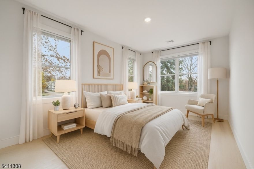 Welcome to this stunning Modern Colonial offering luxury living in one of Essex County's most sought-after communities. Ideally located in Livingston near Hillside Elementary School and just minutes from downtown, this beautifully designed home blends timeless elegance with today's modern conveniences. Proposing four bedrooms and two and one half baths, formal living and dining rooms, family room and more.  The inviting entry opens to a bright, open floor plan with hardwood floors and recessed lighting throughout. The spacious family room features a contemporary electric fireplace and flows seamlessly into the gourmet eat-in kitchen, complete with a large center island, stainless steel appliances, and generous cabinet space. Sliding doors lead to a private patio and expansive backyard, ideal for outdoor enjoyment. A formal living room provides additional space for entertaining; while a separate dining area provides an elegant setting for holidays and special occasions.Upstairs, the primary suite includes a tray ceiling, walk-in closet, and spa-like bath with dual vanities and an oversized shower. Three additional bedrooms and a second-floor laundry room add convenience and flexibility.Smart-home thermostats, a tankless water heater, and energy-efficient systems enhance everyday living. Enjoy suburban comfort with close proximity to shopping, dining, parks, and commuter routes. A rare rental opportunity in one of Livingston's most sought-after neighborhoods.