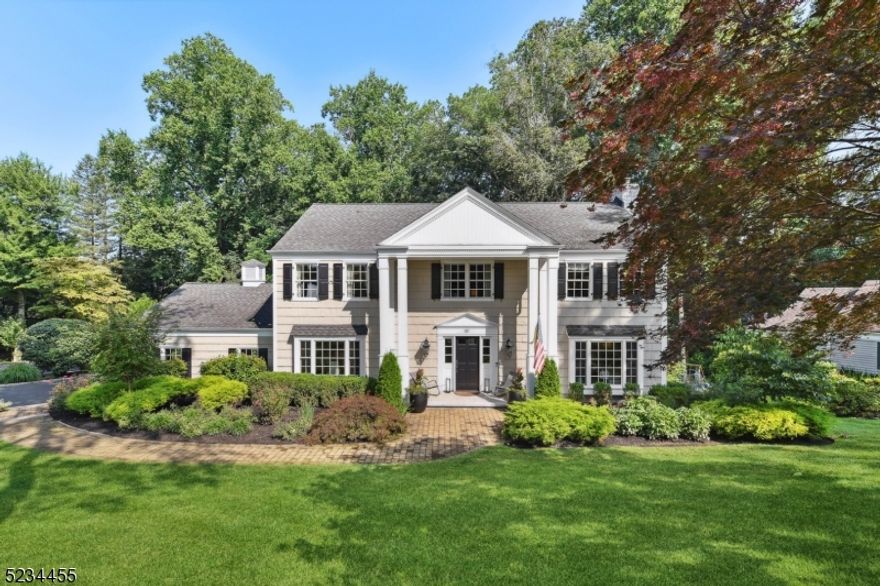 Stunningly gorgeous Center Hall Colonial in serene setting with beautiful plantings and picturesque grounds on cul de sac in the highly desirable Highlands section of Chatham Township.  Light filled rooms, great entertaining flow and multiple levels outside.  Crown/decorative molding and wood floors throughout.  Corniced doorway leads to welcoming foyer which opens to regal dining room and relaxing living room.  Spacious, updated Chefs kitchen with farm sink, elegant backsplash and lamps, beautiful quartz counters and center island/breakfast bar.  Dacor 6 burner, double oven, Sub Zero refrigerator, Bosch dishwasher, wine fridge and microwave drawer.  Breakfast nook connects to family room/den with gas fireplace.  Mud room and kitchen lead out to the full deck with awning and gas fire pit that overlooks the private backyard - perfect entertaining and grilling space. Four large bedrooms including striking master bedroom suite with walk in closet/dressing room and large double vanity private bathroom with spacious shower, second full bath has double vanity and shower/tub.  Washer and dryer also on second floor.  Lower-level, high ceiling, finished basement with full bath, flexible space for working at home, playing or working out.   Walk out to the fantastic redone, double-tiered stone patio overlooking a tranquil backyard. The extended, floored, two car garage and driveway have plenty of parking for all of your guests.  Many upgrades have been done by current homeowners.