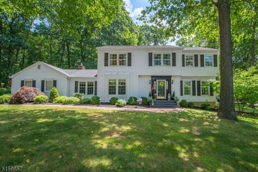 Elegant Nestlingwood classic center hall colonial is set on an oversized corner lot with shade trees and beautiful landscaping!  Renovated kitchen with stainless steel appliances, granite countertops and sunny breakfast area, large family room with gas fireplace, spacious living and dining rooms, all with hardwood flooring and ceramic tile kitchen.  The second floor features a primary ensuite with large outfitted walk-in closet and full bath with stall shower, three additional bedrooms and full bath. Oversized deck, shaded by mature trees, new storage shed, thermal windows, partially finished basement (materials will be left for buyer to finish) and home theater are some of the extras in this comfortable home.  Public utilities, miles of sidewalks close to schools make this development most desirable.**Nest security cameras outside and RING doorbell staying**