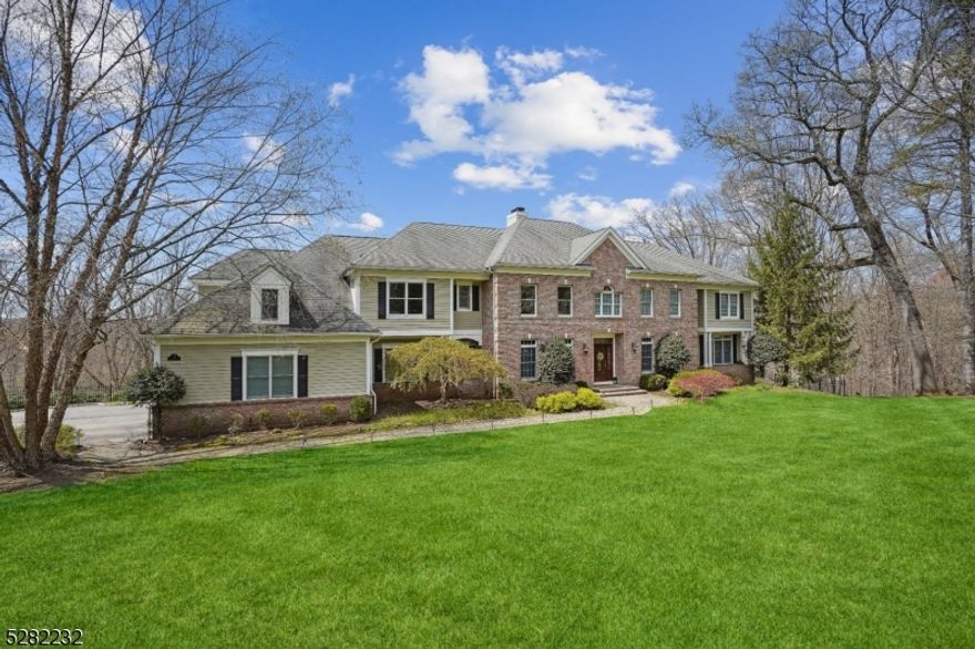 This property is a showplace yet warm and inviting. It is an entertainer's dream yet the perfect place for daily life. From the impressive curb appeal to the breathtaking sunset views, there are surprises at every turn. The two-story foyer greets you with a bright, sunny open floor plan including a gourmet chef's dream kitchen with butler's pantry to a luxurious primary suite with two-sided fireplace, sitting room, two walk-in-California closets, and top-of-the-line new bathroom including radiant floor, soaking tub, oversized spa steam shower with light therapy and five body sprays.  High ceilings, decorative columns, moldings, wired for in-wall speakers, and many sophisticated finishes. Professional work-from-home office with private sun room, library with built-in-shelving, two powder rooms on main level, four fireplaces, first floor bedroom with full bath and walk-in-closet, custom laundry room with folding area and custom cabinetry. Spacious sunny bedrooms with ensuite guest room, Jack-and-Jill bathroom, and huge bonus room on second floor. The walkout lower level is outstanding with stone walls, custom bar area with dishwasher and wine refrigerators, fireplace, cigar room with proper ventilation, sauna, full bath, and golf simulator! Tons of storage, exercise area, three car garage. Fully fenced private yard overlooking Patriot's Path offers level area for play swing set. Lovely tree-lined street close to downtown Morristown. Absolutely extraordinary!