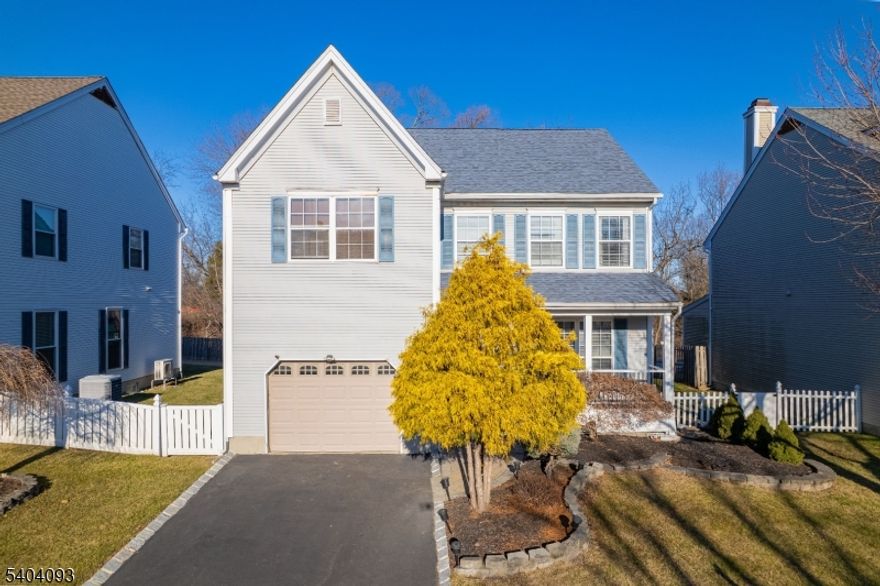 Located in the sought-after Nob Hill community, this beautifully maintained 3-bedroom, 2.5-bath Colonial offers 9-foot ceilings throughout, creating a bright and spacious feel. The first level features brand-new walnut flooring and a thoughtfully designed kitchen with quartz countertops, high-end cabinetry, skylights, a breakfast bar, and a separate dining area. The kitchen opens seamlessly to the cozy family room, where a wood-burning fireplace creates the perfect setting for winter evenings.In warmer months, step outside to fenced in yard, the brick-paver patio ideal for outdoor dining and entertaining. A generously sized living room, formal dining room, and conveniently located powder room complete the main level.Upstairs, hardwood floors extend through all three bedrooms, along with an renovated main bath and a dedicated laundry room. The primary suite is a peaceful retreat featuring cathedral ceilings, a walk-in closet, and an updated ensuite bath with skylight, double-sink vanity, and stall shower.The finished basement adds valuable living space with another family room and private office, while ample storage is available throughout the home, including numerous closets and storage room in basement. The large, fenced backyard offers a well-manicured lawn perfect for outdoor gatherings.Residents also enjoy access to a community pool and tennis courts. This exceptional home offers comfort, style, and modern amenities an opportunity not to be missed.