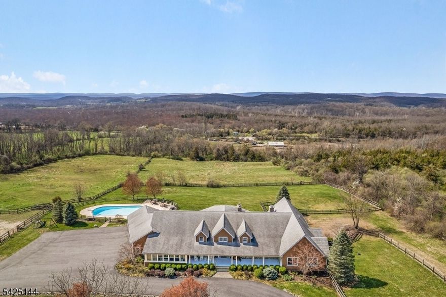 Sparta has a SECRET - it's 71 Kimble Lane!  You'll love this gorgeous, sprawling, custom ranch.  The quality of this home is remarkable.  With a panoramic view, in-ground pool and horse facilities, it is a fantastic retreat.  Set on five acres, the beauty and privacy are unparalleled.  This FIVE THOUSAND SQUARE FOOT custom ranch was built with thoughtful attention and top quality construction shows at every turn.  With an open, easy flow, high ceilings, beautiful crown molding and custom detail throughout, this one is truly spectacular.  The full basement offers a world of possibilities and a fourth garage, too.  Over 100 additional acres available!