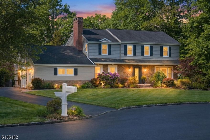 Welcome to 11 Barbara Drive, a Center Hall Colonial set on nearly 1 acre on a quiet cul-de-sac in the sought-after Woods Road School neighborhood. The privacy, space, and setting are truly hard to match and no stone has been left unturned. The home features hardwood floors throughout the first and second levels and recessed lighting, setting a warm tone from room to room. The main level offers a formal living room with wood-burning fireplace and built-in shelves, plus a dining room featuring large picture windows. The open-concept family room with bay window flows into the kitchen, complete with an expansive island with seating for three, electric cooktop, and add'l sink, a gas stove with pot filler, SS appliances, pantry, and a slider to the backyard. A first-floor bedroom, laundry room, and powder room complete the level. Upstairs, the primary suite offers a walk-in closet and a recently redone en suite with porcelain tile stall shower. Three additional bedrooms, a jetted tub hall bath, and linen closet round out the upper level. The backyard is built for entertaining with an in-ground saltwater pool with slide and diving board, Trex deck, gazebo, fire pit area, shed, and custom landscaping. Out front, newer paver walkway and steps and professional landscaping speak to the care this home has received throughout. At over 2,700 sq ft with a two-car garage, so many updates, plus an unfinished basement with real potential. This meticulously kept home is not one to miss!