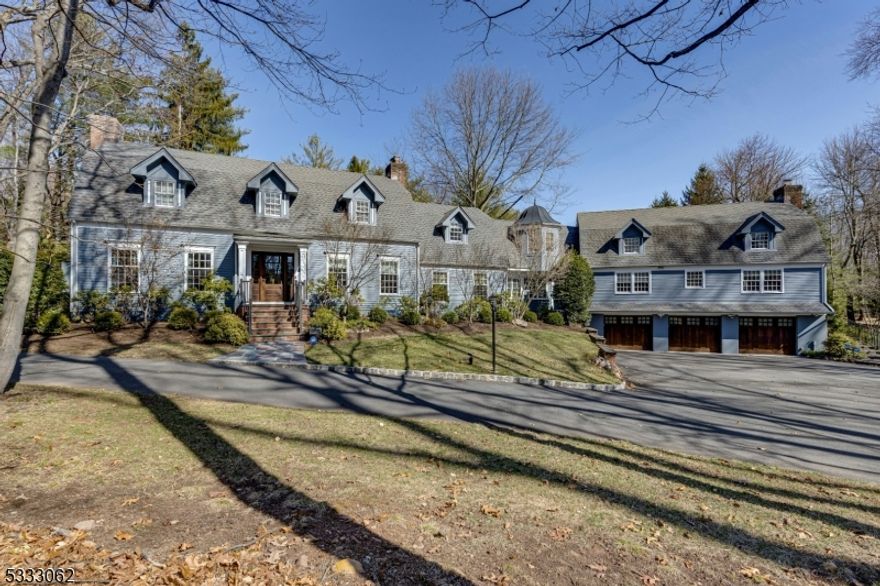 Stately 6 BR, 6.5 BA custom home set on a coveted cul-de-sac w/1.25 acre of prof. landscaped property. Expanded by Needlepoint Homes & tastefully updated by the current owner, this unique gem offers grand curb appeal, great flow, spacious rooms, abundant windows, hardwood floors, custom built-ins & decorative touches throughout!  Entrance foyer w/powder rm. opens to LR w leathered granite wet-bar flanked by 2 glass restaurant-grade display refrigerators. EIK includes SS Wolf cooktop, Sub-Zero refrigerator, Jenn-Air ovens, Cove dishwasher, desk, pantry, mudroom w/heated floor, farmhouse sink, breakfast bar, separate eating area & direct access to DR, den or back patio. Enclosed breezeway w/walls of windows leads to 1st floor guest/in-law suite w/kitchenette & full BA. Expansive family rm. hosts game & media areas, sliding glass doors to back patio & stairs to 3-car heated garage or up to 2nd level w/laundry, 4 more full BAs & 5 more BRs (home office can be converted to BR). Vast primary suite hosts 2 of the 4 full BAs, custom WIC w/dressing & sitting area. Other amenities include 4 fireplaces (2 gas/2 wood-burning), vast lower-level w/fully-equipped home gym, 6th full BA, 2nd laundry room, utility & storage areas. Many points of egress allow access to blue-stone patio, fire-pit, back-yard & heated, in-ground salt water, gunite pool w/shed & privacy fence. Expansive circular, blacktop driveway leads to mudroom w/EV charger. or oversize, heated 3-car garage & 2nd EV charger.