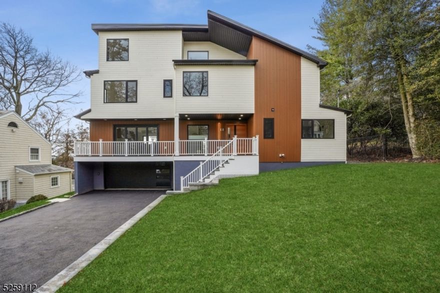 Stunningly renovated 5BR/6BA contempory house with 4300+ sq ft of living space set on .21 acre lot in the best location of the best town! This home boasts spacious open floor plan with 17ft high celing in living room and family room areas with a gas place, custom-made contempory interior with modern hardware, custom closets throughout, all custom made heavy duty thermo-broken aluminum windows and patio doors throughout, double paneled tempered glass filled with argon, tilt and turn windows, 8ft and 10ft bi-fold doors connecting dining and family room areas with large front and back decks and one large balcony on 3rd level with NYC skyline view. The kitchen is complete with high-end Thermador appliances, 24 refrigerator column, 18 freezer column, 36  gas cooktop, 36  prograde range hood with 1000 CFM, 30  combination wall oven and microwave set, 24  dishwasher, 10ft long waterfall center island with quartz counters on both sides ,quartz kitchen counters, and quartz backslash.The 2nd floor is home to a luxurious master suite, 2 additonal bedrooms and 2 full baths. The 3rd floor features a large bedroom, a full bedroom, a 2nd family room, and laundry room. Fully finished basement with mud room, rec room and full bath. Backyard is completely fenced. Must See!!!