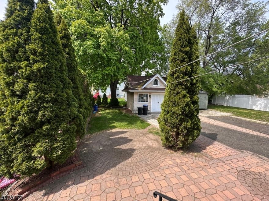 This fully updated residential home combines comfort and space. Move-in ready, it features 3 generously sized bedrooms, a full bathroom with a jacuzzi tub and standing shower, along with two additional half baths for added convenience. The main level boasts a spacious and inviting living room, a formal dining room, and an updated kitchen designed for both everyday living and entertaining. Recessed lighting throughout the home adds a clean, modern touch.  A fully finished basement provides additional living space, ideal for a recreation room, home office, or guest area. The walk-up attic offers excellent storage and future potential. Enjoy year-round comfort with central air conditioning and forced heat. Outside, the property features a shared driveway entrance leading to a private parking area in the rear, a backyard perfect for outdoor enjoyment, and a separate storage shed for added storage.A well-maintained and thoughtfully upgraded home, ready for its next owner.