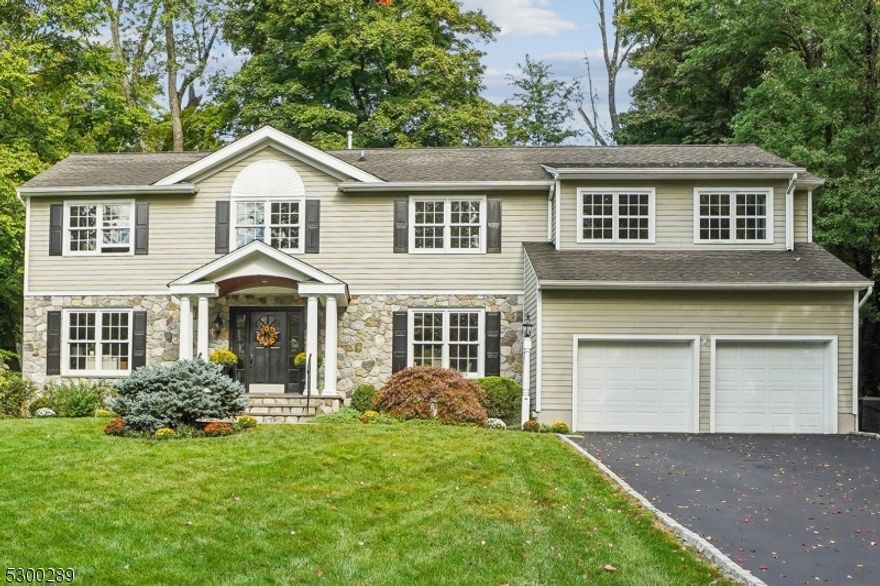 A beautiful pristine Center Hall Colonial home, ideally situated in the heart of Chatham Township.A meticulously maintained and elegantly updated home offering  modern convenience with a classic charm. Designer-decorated foyer leads to the sophisticated living and dining areas. Renovated in 2007 and freshly painted 2024.The stunning custom cabinetry in the chef's kitchen, complete with a large center island, high-end stainless steel appliances, and granite countertops, seamlessly transitions into the expanded Great room, featuring a wet bar and wood-burning fireplace.The back stone patio leads to the beautifully fenced in yard, perfect for hosting outdoor gatherings or simply relaxing.The two-car garage connects to a mudroom and a back staircase leading to a versatile nanny/in-law suite. This independent living space boasts a full bathroom, bedroom, and sitting room, offering flexibility as a guest suite or a spacious home office. 5 bedrooms, 3.5 bathrooms including a master bedroom with a walk-in custom-fitted closet and a fabulous en-suite. In addition the  fifth bedroom also features a custom-fitted walk-in closet and en-suite. The finished basement provides a cozy retreat rec room/playroom and ample storage space. Additional amenities include hardwood floors throughout, a security system, sprinkler system, two fireplaces (1wood-burning, 1gas), a home stereo system, a full-home generator, steam shower.  This gorgeous home ensures comfort and luxury for all.