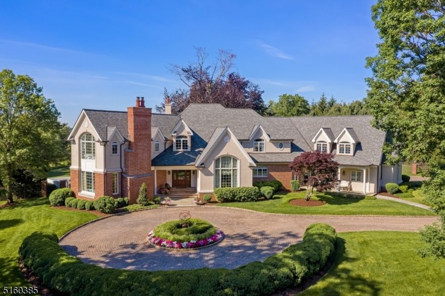 Sophisticated, enlivened, engaging. There is such a joy to this custom home that is approx. 9500SF, including the finished lower level. Privately set on 3 beautifully landscaped acres, there are gorgeous views to the Somerset Hills from the pool w/ sundeck & spa, expansive terrace w/ fireplace, kitchen, bathroom and outdoor shower. Indoors, varying height ceilings, window filled soaring walls, hardwood and marble floors, extensive millwork, fireplaces, and the gifted talents of an interior designer prevail throughout formal and informal spaces. The two-story foyer is followed by a welcoming area with bar. Cooking & gathering will be a delight in the expansive kitchen with high quality appliances, island with contiguous high-top table and large informal dining area opening to the terrace. Mahogany paneling and built ins distinguish the library. Ceilings in the dining room & great room are vaulted, the latter further detailed w/ shiplap & beams. The living room presents full carved-panel walls. Multiple French doors grant passage to the exceptional grounds. Located on the upper level, the 5 bedrooms are each accompanied with walk-in closets and bath. Luxurious Primary Suite w/ room-size closet opening to the updated bath offering quartz surfaces and a radiant heated floor. The lower level features; media & game areas, bar, wine cellar, exercise rooms, bath and tucked away utilities &mechanicals. The 4 car garage has an organization system and enjoys heating and air conditioning