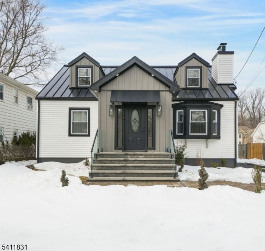 This completely renovated home offers approximately 2,500 square feet of beautifully designed living space. Located on a quiet street in a highly desirable West Orange neighborhood. Featuring an open floor plan ideal for modern living and entertaining, the home showcases a stunning gourmet kitchen with stainless steel appliances, wine refrigerator, granite countertops, and detailed finishes throughout. The inviting living room boasts a charming wood-burning fireplace and flows seamlessly into the dining area. First floor includes a bedroom and main bath. Second level offers a private primary suite with a luxurious primary bath and stall shower, an additional bedroom and a versatile office area. The fully finished lower level provides extra living space, a full bath, laundry area and ample storage. Exterior upgrades include new siding, Standing-Seam metal roof, driveway, stairs and railings. Completing the property is a two-car detached garage, abundant parking, grassy area with a shed and privacy fence perfect for relaxing or entertaining. Ideally located just minutes from Turtle Back Zoo and South Mountain Reservation, this home also offers convenient access to the local Park-and-Ride with shuttle service to nearby train stations, making commuting a breeze.