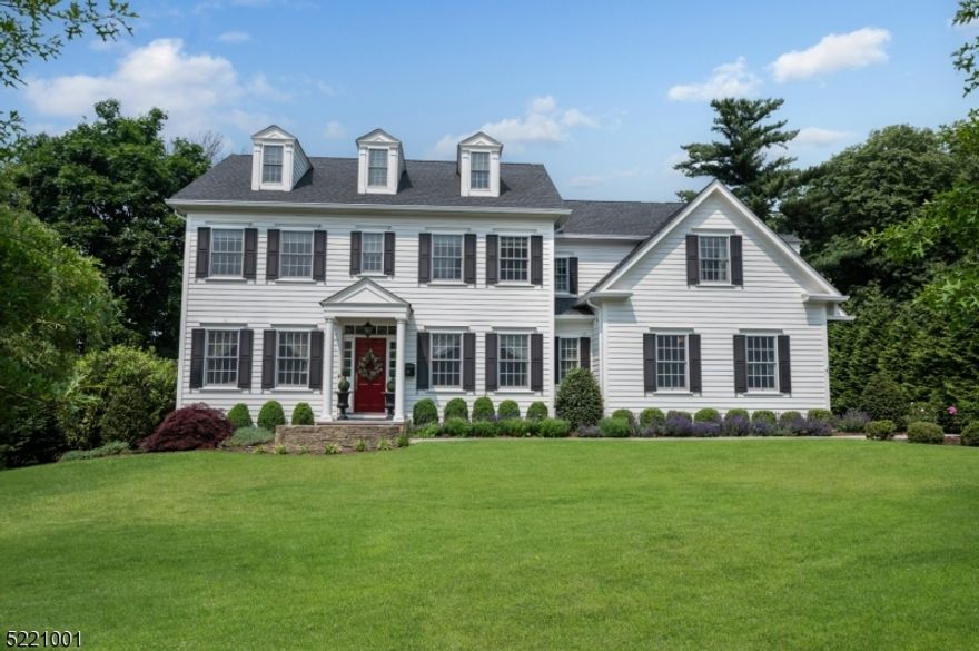 An architectural W.P. Lloyd colonial masterpiece. The home exudes a luxurious aesthetic, custom crown moldings, high ceilings & a serene color palette throughout. Built in 2016 with 5 bedrooms including 2 primary suites, 5.1 baths. This home is located in the desirable Hill section of Madison. Living room and dining room off elegant entry foyer. Gourmet chef's kitchen with large island is a hub for culinary activities & casual dining. Butler's station with extra storage, ice maker & walk in pantry leads to outdoor kitchen perfect for alfresco dining. First floor office suitable for working from home. Second floor boasts sunlit primary suite #1 with sitting room, lavish spa bathroom and fabulous custom walk-in closets. Primary en suite #2, featuring two additional bedrooms with Jack and Jill style bathroom. Convenient second floor laundry room. Third floor features private guest suite for multigenerational living. The fully finished lower level features high ceilings, recreation room with a bar/built in dishwasher, refrigerator and separate climate controlled wine room, exercise room and billiard room. Charming train town, easy access to NYC & EWR airport. Blue Ribbon Schools, great shopping restaurants and recreation.
