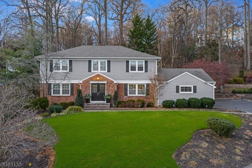 SPECTACULAR, Fully Renovated Home on Baltusrol Top. Bright & sunny w/designer finishes, fixtures & gleaming hardwood floors. Light filled, beautifully updated kitchen designed to meet every culinary need w/crisp white cabinetry, quartz countertops, tiled backsplash, & generous center island, SS appliances, double wall ovens, gas cooktop, French door fridge, wine fridge, built-in microwave, & trash compactor. Sunlit breakfast area w/ dual skylights & custom built-in bench provides cozy gathering spot, sliding doors to expansive composite deck & lush yard. Formal dining room, living room, family room, laundry room & updated powder w/convenient access to garage completes this level. Upstairs, the primary suite is a true retreat, featuring two fully outfitted closets and a spa-inspired en-suite bath w/ dual-sink quartz vanity & grand glass-enclosed shower, creating a serene and luxurious space to unwind. The remaining bedrooms are bright & well-proportioned, served by a beautifully renovated hall bath with a dual-sink quartz vanity & subway tile surround. The finished basement adds even more living space as a spacious rec room, entertaining space with bar, perfect for movie nights, playtime, or a home gym. This level offers flexibility for any lifestyle, making the home ideal for both entertaining & everyday living. Whole House Generator, underground sprinklers, newer roof, HVAC, deck, windows, siding and more. Bus to schools, close to NYC train & bus, highways & downtown Summit.