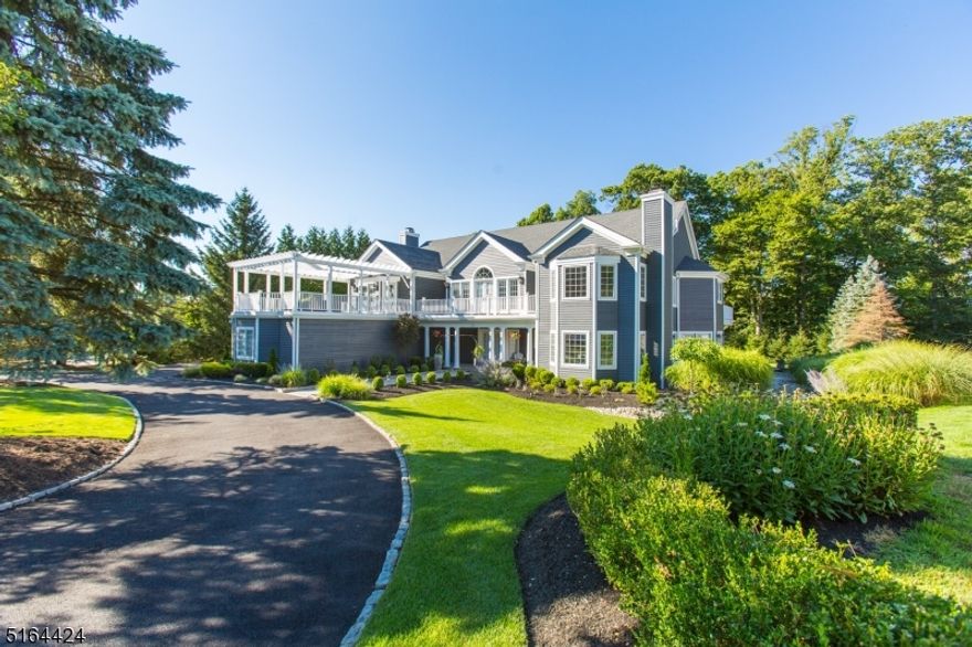 Exquisite one of a kind custom built classic Hamptons style estate home.  The wow factor will astound from the curb!  Lush landscape & unique architecture greet you as you approach the covered porch to enter.  A stunning octagonal 2 story foyer as you enter that opens to outrageous soaring ceiling LR w/floor to ceiling stone FP & DR welcome you in.  Glass doors from LR to game room that opens to covered patio is the pinnacle of entertaining!  Gourmet updated Chef's kitchen w/prof grade appl., Quartz counters, wet bar, sep break room w/wall of glass that leads to patio & is completely open to FR anchored w/FP--just stunning!  Two powder rooms, mud room & two story library w/back stairs complete the main level.  The upper level is a show stopper!  Primary ste w/grand rotunda, dressing room, custom WIC, spa like bath & wrap around deck over looking property is just breath taking.  Upper level loft that peers down into LR & foyer--elegant & grand!  two addl gigantic bedrooms w/WIC, & two room Jack & Jill bath & a massive en-suite w/spa like bath, WIC & sliders to gracious roof deck--a total oasis.  The LL offers, rec room, media area, storage, gym/5th bedroom, full bath, office area, & so much more.  This majestic home is located on one of most prestigious streets in NC.  This prime location is conveniently located close to NYC trans., shopping, restaurants, schools, parks & more.  This substantial home offers the ultimate luxury lifestyle!!