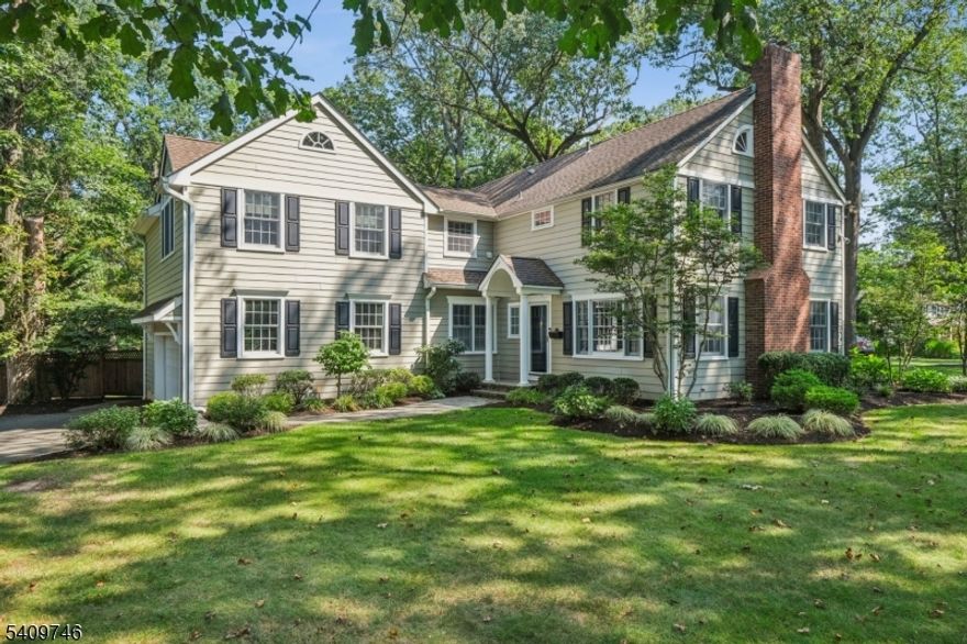 Set on a rare, level .99-acre property on one of New Providence's most coveted streets, this beautifully maintained four bedroom, four and a half bath home offers the ideal balance of classic architecture and modern functionality. Two thoughtfully designed renovations enhanced the home; adding a generously proportioned primary suite, convenient second-floor laundry, and an open kitchen-family room that serves as the true heart of the home. A light-filled formal living room with gas fireplace and elegant dining room provide timeless entertaining spaces, while a separate sitting room with dry bar and built-in beverage drawers creates a relaxed gathering area ideal for hosting. The nearly one-acre property is equally impressive outdoors; featuring a spacious deck, an underground sprinkler system and an invisible dog fence. Practical upgrades including a hydro sump pump with battery backup and a generator plug-in panel with generator offer peace of mind year-round. An over-sized two-car attached garage completes the package. Ideally located less than a mile to Murray Hill Train Station and within approximately one and a half miles of the elementary, middle, and high schools, this is a rare opportunity to own a turnkey home in one of the area's most desirable communities.