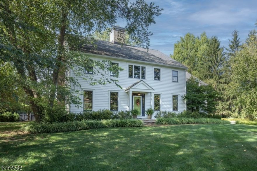 Situated on nearly 2 picturesque acres in Chester's prestigious Hedgerows neighborhood, this impressive colonial blends authentic architecture with enduring appeal. Featuring a wood shingle roof and distinctive architectural details, the home evokes the warmth of a historic residence while offering the comforts of modern living. Created with both style and function in mind, this home offers four thoughtfully curated floors. The formal dining room is ideal for holiday gatherings, while the living room is a lovely place to read or relax. At the heart of the home, the gourmet kitchen boasts a large center island, custom pantry, and breakfast area, seamlessly opening to the family room with a fireplace an inviting space for everyday living and entertaining.The luxurious primary suite includes a versatile sitting room, walk-in closet, and spa-inspired bath with a soaking tub, oversized shower, and dual vanities. The finished basement offers a recreation room, fitness area, workshop, and storage, while a third-floor office and second-floor laundry add flexibility to the floor plan. A custom mudroom and three-car garage enhance functionality. Outdoor living shines with a deck overlooking the in-ground pool, lush landscaping, cultivated gardens, outdoor fireplace, and expansive level yard. Nestled in a coveted neighborhood near top schools and downtown Chester, this home blends architectural character with modern amenities in a truly special setting.