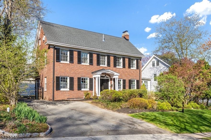 Classic brick Colonial meets editorial-level design in the coveted South Mountain section of South Orange, just moments from the NYC train, schools, coffee shops, bakery, record store, art supply shop, and parks. Thoughtfully curated and featured in DOMINO Magazine, this home delivers the kind of elevated, effortless style today's design-forward buyer is searching for. Inside, rich hardwood floors, a wood-burning fireplace, and beautifully balanced spaces create a warm yet refined aesthetic. The sun-drenched Maplewood room offers the perfect flex space for a home office, toy room or lounge, with seamless access to a private stone patio and backyard, designed for relaxed outdoor living and entertaining.The designer kitchen pairs clean, modern finishes with smart functionality, and the renovated baths including a stunning new primary shower bring a spa-like feel to everyday routines. The spacious designer primary suite offers a true retreat with an en-suite bath, and the third floor adds two additional bedrooms and a full bath, ideal for guests, creative space, or work-from-home flexibility. Notable upgrades include a three-zone HVAC system with new heating (2025), double-pane windows, whole-house water softener, reverse osmosis kitchen filtration, and a 2017 roof. A rare blend of timeless architecture and magazine-worthy design, creating a vibe that feels iconic and now, this home offers a turnkey lifestyle in one of South Orange's most sought-after neighborhoods.