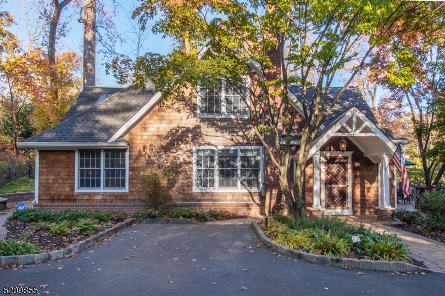 Your own private sanctuary right in the heart of Morristown. On nearly an acre, this painstakingly restored custom home is one of Morristown's most prominent homes. Each inch of the home was thoughtfully designed from handmade front door and matching deck rails to the exceptional primary suite with exposed beams and paneled cathedral ceiling. The main level offers a living room and dining room each with a wood-burning fireplace, wonderful built-ins and period charm; a bedroom with fully updated ensuite complete with double vanity; and powder room with laundry. The chef's kitchen has a large center island, stainless appliances and pantry with barn door. There is a mudroom area with bench and storage off the kitchen that offers easy access outside for bringing in groceries or for grilling. Upstairs is a remarkable master suite with sitting area, room for an office space and ensuite bathroom. Outside privacy abounds with gardens, a large composite deck, gazebo, and shed. There is a detached two-car garage with an additional space with heat/AC for a home gym, workshop, or could be converted to a home office area. Located a half mile from South Street in one of Morristown's most sought after areas, this home should not be missed.