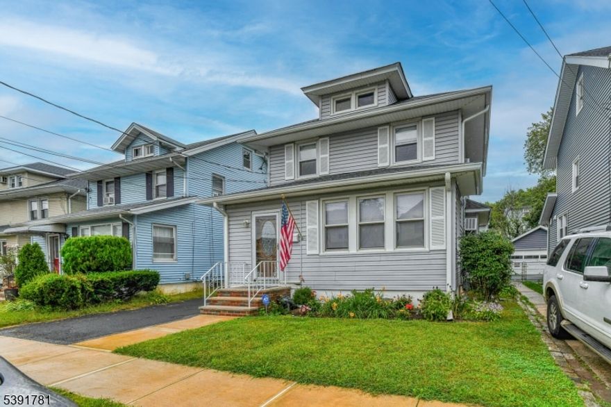 AAA Move-In Condition: This charming Hillside colonial has been lovingly cared for, for more than half a century, ensuring exceptional maintenance and pride of Ownership. Enjoy newly sanded and refinished hardwood floors throughout the home, adding warmth and elegance to every room. The large kitchen features granite countertops, toe kick heaters recessed lights and an abundance of cabinet space. Modern stainless steel appliances. Sliders from the kitchen lead to a generous deck overlooking a fenced-in yard perfect for entertaining or relaxing in peace. Even space for a garden. The roof, sheathing, leaders, gutters and gutter guards were replaced just 2-3 years ago. New front steps and sidewalks add to the home's curb appeal and pride of ownership.  Thermopane windows, updated hot water heater, and furnace mean major systems are already taken care of. The walk up attic provides plenty of storage space. Conveniently located just a short distance ( a hop, skip, and a jump ) from A.P. Morris School. Easy walk to nearby houses of worship. Quick access to NYC Bus on North Broad, as well as access to Rt.22, GSP and NJTPK making commuting simple and stress-free. The long driveway provides plenty of parking + large garage. This beautifully maintained colonial offers everything you need for comfortable living in a sought-after neighborhood. With all major updates completed and a prime location close to schools, worship, and transportation. PREVIOUS BUYERS COULD NOT CLOSE TITLE