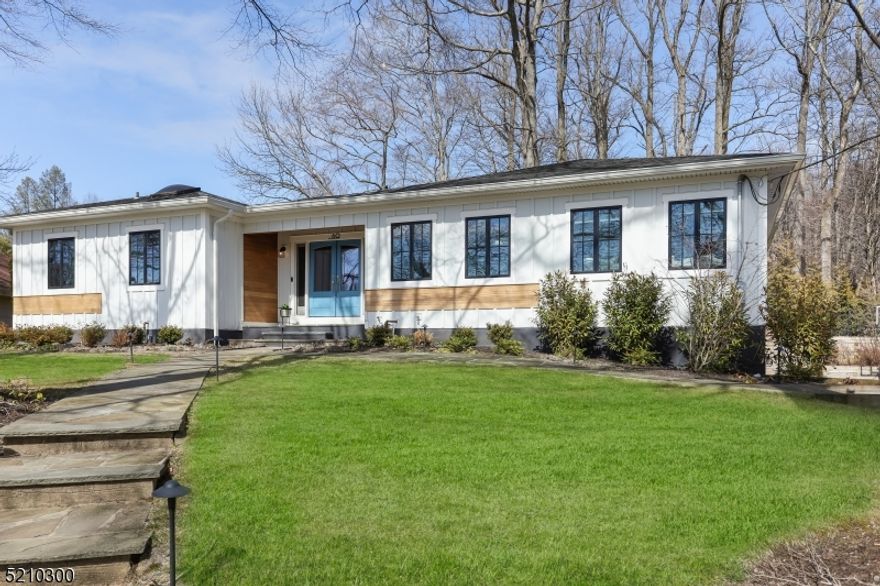 Certain to draw attention, this contemporary-style ranch constructed with James Hardie board rests on almost two-thirds of an acre of gorgeous property.  Inside, well-proportioned rooms are bathed in natural light, as vaulted ceilings and a neutral decor add to your sense of space.  Three sets of sliders lead the way out to the patio and deep, level backyard creating an easy indoor/outdoor flow.  Bedrooms are comfortably nestled away from the main living areas, while the lower level has an additional bedroom, recreation room,  full bath, and cedar storage   The backyard has both a large entertaining area equipped with a water feature and gas fire pit as well as plenty of trees to offer you the beauty and sounds of nature.  The primary suite and main bathrooms were renovated in 2023 in addition to all new trim and doors throughout the home.