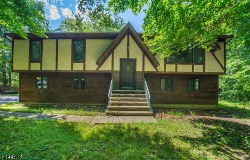 Location, location. What a wonderful setting for this 2200 sq ft bi level situated at the end of a quiet cul de sac. Enjoy the privacy this home affords. The home features good size rooms, four bedrooms and 2.5 baths. Wood floors grace the living room, dining room and all bedrooms on the main level. You will appreciate the view from the kitchen and dining room looking out at the peaceful backyard. There is also a pretty view from the living room looking out to the front of the house. You will love the family room with the brick floor to ceiling wood burning fireplace. You will be able to control your heating bill with the multi zone heat. Boiler was replaced in 2017. Water heater 2017 and roof 2012.