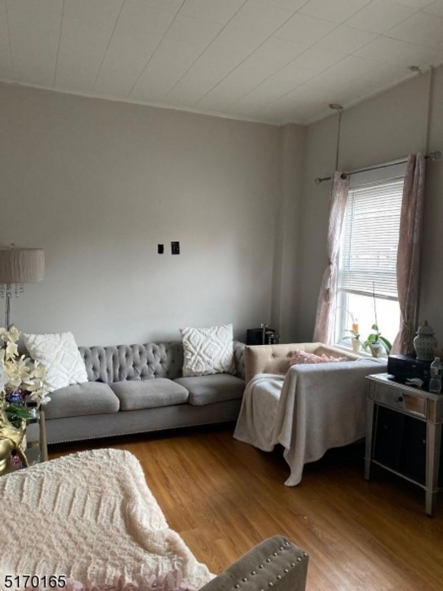 Great 1st floor apartment. 3 bedrooms and 1 and 1/2 baths. Large eat in kitchen. Large basement unfinished w/ laundry hook-ups.Shared parking lot in rear. Close to major highways and NYC. NTN report required along with POI.