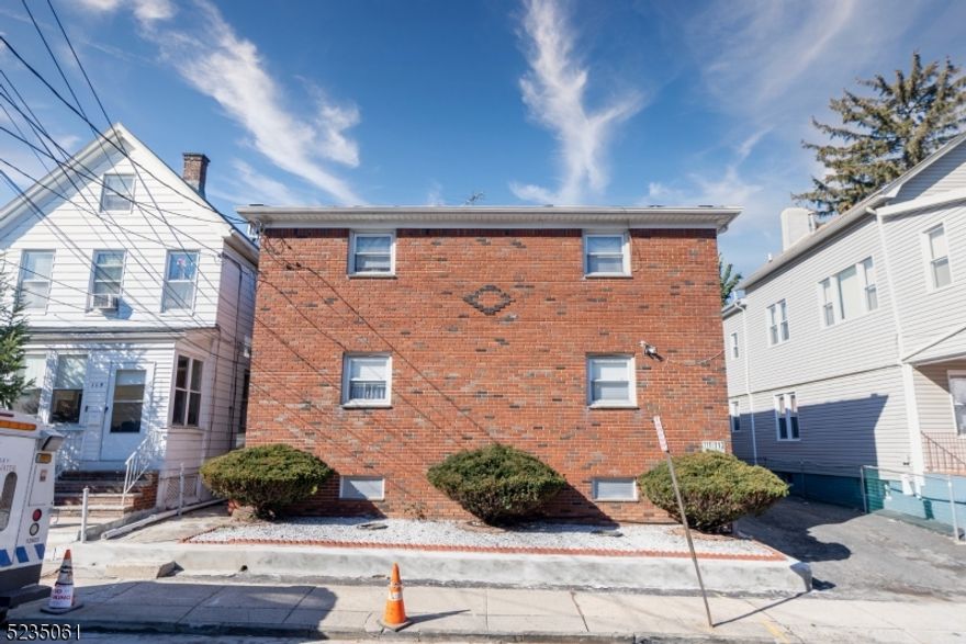 Amazing investment opportunity! in the heart of Elizabeth! Legal, brick 4 family with a total of 8 bedrooms and 5 full baths. All units with hardwood floors throughout, spacious living rooms, eat in kitchens, and full bath. Two separate basements, one partially finished with recreation room and full bath. Parking spaces for 3 cars. All separated utilities. Ideal location, only a few blocks from train, downtown Elizabeth and major highways. Tenants are month to month. This is an investor's dream! Come and tour it today!