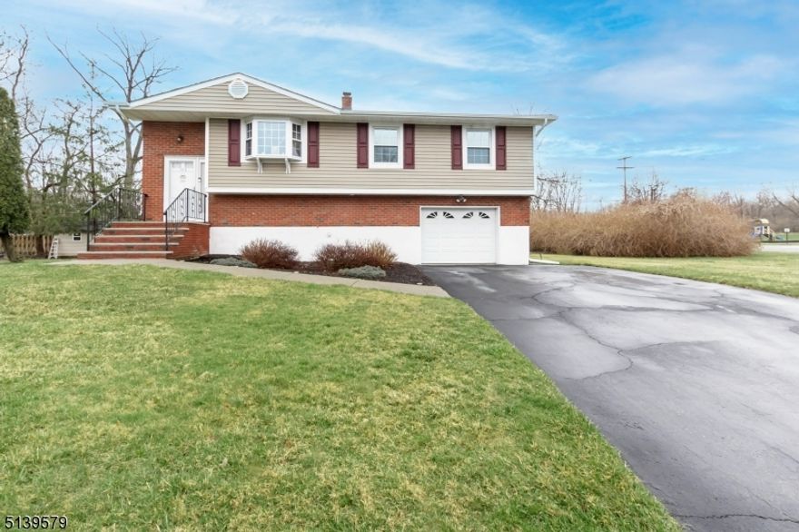 Great opportunity to move into one of Hackettstown's most desirable neighborhoods, offering city water & sewer & natural gas utilities! This meticulously maintained home has much to offer including, hardwood under upstairs carpeting, 4 bedrooms, 2 completely remodeled bathrooms, spacious open living room, light and bright dining room off kitchen which leads out to an entertainment size deck with majestic mountain views! The walkout lower level with bedroom, full bath and family room makes for an ideal in-law suite. Walk out to a private patio which looks out to the level parklike property! A walking neighborhood near all convenience's schools, hospitals, recreational facilities, shopping, fine dining and NYC train & bus. These are just some of the features of this truly must-see home.