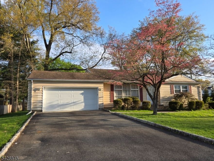 Welcome to this delightful split-level home, a true gem in Pompton Plains! Originally purchased from the builder in 1955, this residence boasts three bedrooms and 1.5 bathrooms. Situated on a beautiful 116x130 corner lot, this property features stunning curb appeal that will make you proud to call it yours. Step inside to discover a spacious main floor with cathedral ceilings in the living room and wood floors that can easily be refinished. Plenty of nature lighting from the large front window. The eat-in kitchen also with high ceilings and has equipped with an updated stainless steel refrigerator, stove and microwave, and a convenient side door to the rear yard. The lower level offers a generous size family room, maintenance free paneling and a half bathroom, an office, and a laundry room all could use some updating. Rear door to the yard too!. Central Air updated 2000, newer hot water heater, 2023. Located in a beautiful area, close to Greenview Park, local schools, the Pompton Valley Bike Trail, Chilton Medical Center, and more. If you're looking for a home with potential for your personal updates, this is the perfect opportunity!