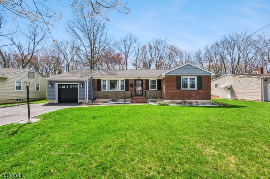 Nestled in one of Berkeley Heights' most sought-after neighborhoods, this beautifully updated 3-bedroom, 1.5-bath ranch offers the perfect blend of comfort, style, and move-in-ready convenience. From the moment you arrive, the enhanced curb appeal sets a welcoming tone. Inside, you'll find a bright and inviting layout highlighted by wood floors, fresh paint, and on-trend finishes throughout. The updated Kitchen showcases modern updates and flows seamlessly into the spacious living and dining areas, creating an open, airy setting ideal living and entertaining. Just beyond, the sun-filled family room features expansive windows and newly installed vinyl flooring, offering durability and a clean, contemporary look. Whether you're enjoying a quiet evening with a book or hosting movie night, this space feels both cozy and connected to the outdoors. The finished basement adds valuable flexible living space perfect for a recreation room, home office, or workout area. Outdoor living is where this home truly shines. A fully enclosed privacy fence surrounds the rear property ensuring privacy. The renovated/refinished deck provides an inviting space for entertaining or simply relaxing. Ideally located just minutes from the BH train station and close to major highways, commuting to New York City is effortless. Top-rated schools, parks, and shopping complete this exceptional offering.This is a wonderful opportunity to enjoy updated, easy living in an unbeatable location.