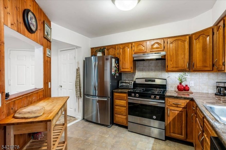 Move-in ready 2nd floor unit in the desirable Garret Heights condo complex! This Oxford model features 2 BR's, 2 Full Baths, Kitchen with marble stone counters and new appliances. The spacious Living Room offers a wood burning fireplace and the formal dining room has sliders to a new covered deck. The Primary Bedroom features double closets and ensuite with jetted tub, marble counters and porcelain tile floors. The second bedroom also includes double closets. Beautiful Bamboo Hardwood floors, and recessed lighting adorn the unit.. New painting and carpeting the in the common stairs area. Newer Water Heater, Central Air &in-unit laundry are added conveniences. Walk to to Garret Mountain Reservation for fishing, picnic grounds, horseback riding & hiking trails. Close to major highways, shopping and transportation. Pet-friendly. All appliances included. Not FHA approved. Sold as-is including fireplace and chimney(no known issues.)