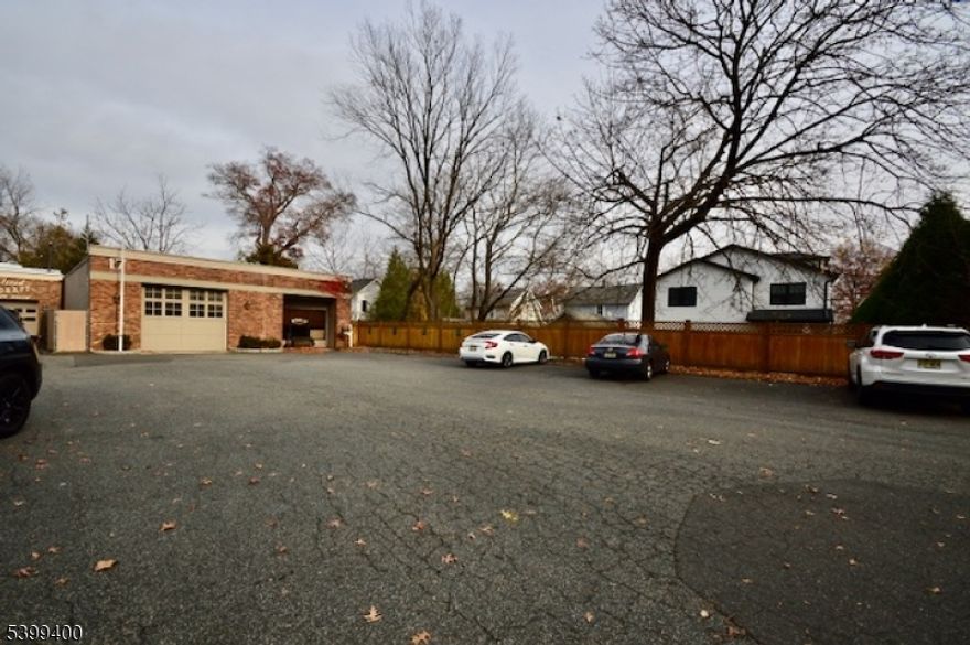 This Unique location near downtown Chatham Borough providing storage, office and parking for contractors business.  There is limited locations in Chatham where a contractor can operate their business and store vehicles and equipment.  The brick building has office space, bathroom, conference room and office storage.  The warehouse has two roll up doors allowing for access to interior storage and the rear storage yard that is a secured area for valuables.  The building can be rented as well and is listed on the MLS for rent as well.  This is a clean site and has had environmental remediation performed and approved by DEP.
