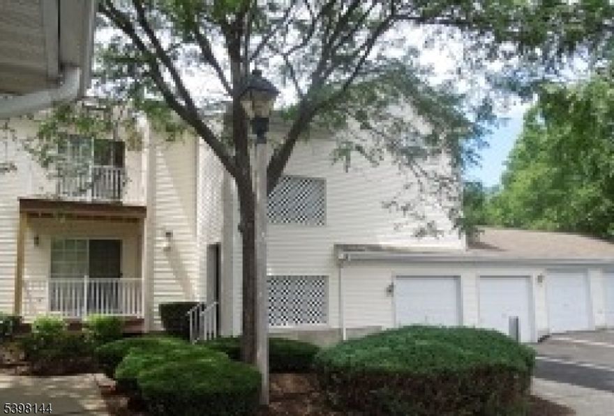 2 Bedroom, 2 Bath second floor condo, end unit with den, garage & basement storage area.  New Heating and air conditioning systems in December of 2017.  Full size W/D, garage door opener, private deck off living room, eat-in kitchen, open and airy floor plan.