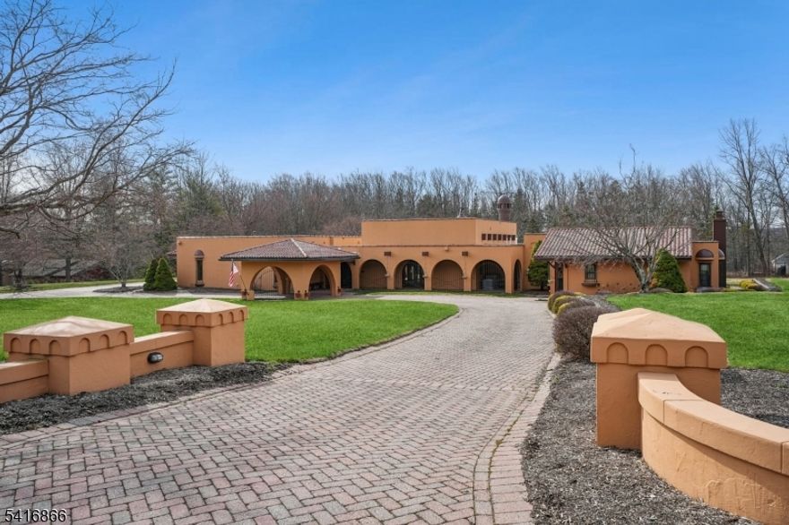 Nestled on 3 private acres in the highly sought-after Washington Valley section, this exceptional custom-built home offers the perfect balance of luxury, privacy, and functionality. Featuring 4 spacious bedrooms and 5 full bathrooms, this residence showcases quality craftsmanship and distinctive architectural details throughout. The main living area is the heart of the home, highlighted by soaring ceilings with beautiful exposed beams that create a dramatic yet warm atmosphere. Elegant arched windows and doorways add timeless character while allowing natural light to fill the space. The thoughtfully designed layout provides a seamless flow that is ideal for both everyday living and entertaining. The primary suite serves as a luxurious private retreat, featuring a large walk-in closet and the rare convenience of two full bathrooms for added comfort and privacy. Each additional bedroom is generously sized, offering plenty of space for family or guests. A standout feature of the property is the private in-law suite, complete with its own bedroom, full bathroom, living room, and kitchen perfect for multi-generational living. Additional highlights include a 3-car garage, whole-house generator, in-ground pool, and sports court, all set on beautifully maintained grounds that provide both privacy and space to enjoy the outdoors.