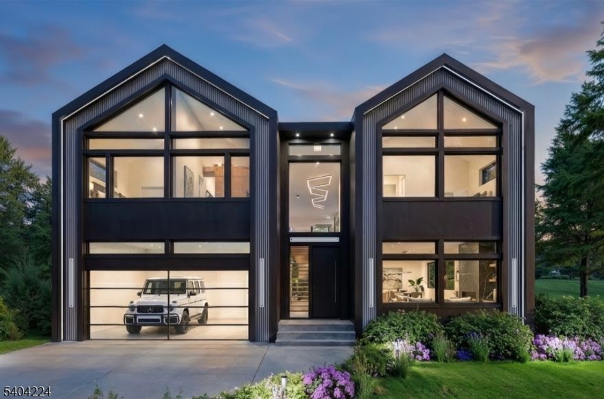 Bold lines, refined finishes, and dramatic volume define this ultra-contemporary showpiece. Designed for both style and function, this home offers an impressive layout with 6 bedrooms, 5 full bathrooms spanning 4700 sf of total living spaces, and a 2-car glass-enclosed garage At the heart of the home is a sleek, modern kitchen a true culinary centerpiece featuring minimalist cabinetry, top-of-the-line appliances, and an over sized island perfect for gathering. The kitchen flows seamlessly into expansive living and dining areas, creating a bright, open layout that's ideal for entertaining or relaxed everyday living.The primary suite is an elevated retreat with a private balcony, boutique-style walk-in closet, and a spa-inspired bathroom. Upstairs, all four bedrooms feature vaulted ceilings with integrated cove lighting, adding architectural flair and airiness.This home is a masterclass in ultra contemporary design thoughtful, functional, and undeniably beautiful. Built by Exodus Development