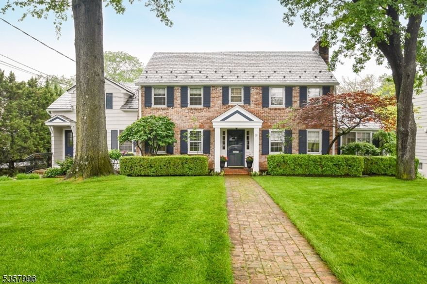 Classic brick georgian colonial on almost 1 acre of deep park like property. Beautifully renovated with 5 bedrooms and 3 full baths on the second floor. The white gourmet kitchens has an island and  dining area, granite counters, Viking stove plus a wall oven. A charming wet bar with glass cabinet is in an area convenient to family room, kitchen and dining room. The kitchen opens to the expansive family room overlooking a fabulous flat rear yard, deck and terrace. The  fireplace centers the elegant living room which has glass doors leading to an office boasting cathedral ceilings and large windows. A formal dining room and new powder room complete the first level. The open second floor landing welcomes you to 5 roomy bedrooms and 3 full baths. A finished walkout basement level features a mudroom, a rec room, large laundry room and storage. There is also a delightful sixth ensuite  bedroom. Located in a wonderful neighborhood close to town and transportation. Sidewalks on both sides of the street. Easy to show.