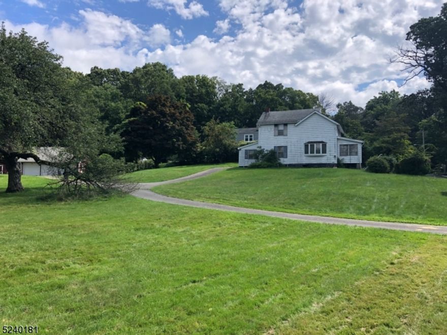 No survey available only an engineer drawing for a possible  2 lots of approx 1.5 acres each , but has never been submitted to town or approval.  Existing house in need of repair or possible knockdown. House being sold "as is" . City water in street and natural gas in street. Separate large 3 car+ garage,  Lots of possibilities with this property, renovate house, knock down house , due diligence by buyer to inquire with town for possible 2 building lots.