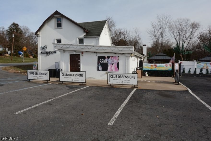 An excellent investment opportunity is offered now in Hunterdon County NJ.  Found on your Google page is "Obsessions" 159 State Rt 31 in Hampton - the legal and true address is 157 State Rt 31.  Currently a social club and bar with dancing as entertainment, it operates with a Class C 33 liquor license and is open 7 days a week.  Income approx. 500,000 per year, but with plans in place for a future and viable addition and patio, this well traveled location could also easily thrive as a sports bar or, as it is now, a club with a lot of daily activity and customers.  43 parking spots, capacity for 155 people in a 3500 sq ft building on almost 1 acre of land.  Taxes are approx. $11,000 per year.  The building has 2 ATMs, very high technology in place, TVs and 34 security cameras that operate 24 hours a day with sophistication. Vast potential at this location to bring this exciting place to new tiers of success with your innovation and creativity.Many upgrades to this establishment.  Schedule and appointment and come see for yourself!