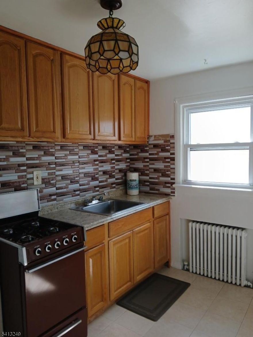 Private Entrance, 2nd Floor. One Bedroom, Living Room, Kitchen, Full Bath, 2 Walk-in Closets. Rent Includes: Heat, Hot & Cold Water, Cooking Gas, Tenant Pays Electric and Cable. Located in Passaic Park. Convenient to New York Train and Bus, Highway 3 East & West, Highway 21 North & South, 46 North & South, Tennis Courts, Basketball Court, Beautiful Park for walking and Biking, Boat House Cafe located in the Park.