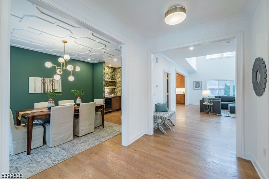 Experience the best of contemporary living in this exceptional nearly 4,100 sq ft. newly built home, stylishly designed for comfort & modern living. Impeccable design & high-quality craftsmanship by Lefko Brothers, combine in this thoughtfully planned custom Colonial featuring 9' ceilings, oak flooring, curated lighting, detailed millwork & loads of windows offering incredible natural light. Step through the front center Foyer & into open & sun-drenched rooms that invite gathering & relaxation. Elegant Living Rm is mirrored by the formal Dining Rm w/ Butler's Pantry incl. wine frig. Easy flow into the spacious dream Kitchen anchored by a huge center island & top-of-the-line appliances created for the fussiest of chefs! Adj. Family Rm ideal for casual dining & gathering w/soaring 2-story vaulted ceiling comfortably welcomes all with its gas Fireplace & sliding doors to the rear patio & side yard, the perfect outdoor entertaining venue. 1st Fl. en-suite BR, customized Mudroom w/ access to 2-car Garage & Powder Rm completes this level. Upstairs, the Primary suite becomes your personal sanctuary, featuring a serene Dressing Rm, spa-like Bath, & generous WIC. Three additional BRs, one en-suite & 2 w/ Jack-n-Jill bath, loft & convenient Laundry Rm round out the 2nd Fl. The fully finished Lower Level features an extra-large Recreation Rm w/ built in dry bar, BR w/ full Bath & Office. Ideally situated only 0.7 m to downtown Maplewood Village & 2 blocks to jitney service to NYC train.