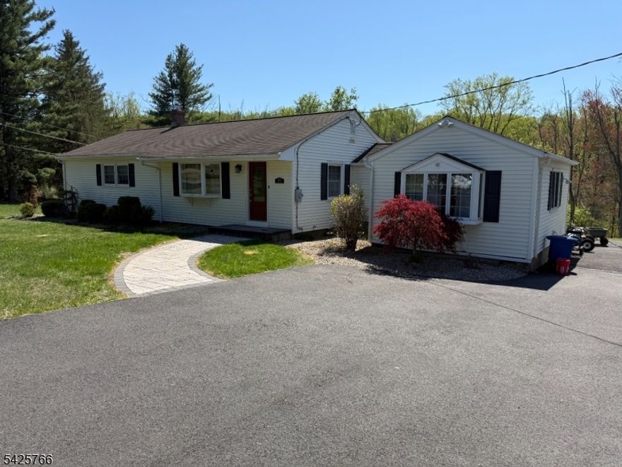 A great opportunity to own this 3 bedroom ranch in excellent condition and loaded with extras! The first floor has been recently painted and features 3 bedrooms, a large modern kitchen w/ granite counter tops, stainless steel appliances, wood-look tile flooring, & overhead recessed lighting. The family room offers a new direct vent insert style pellet stove with a custom granite hearth, vinyl plank flooring, flat screen TV, bay window, and custom built-in cabinets. The living room features chair rail molding, bay window, hardwood flooring, and new entry door with digital entry. Ceiling fans throughout. The basement offers a walkout to the backyard and includes a playroom/office, storage room, workshop, and laundry room. There is a new water filtration system, generator transfer switch, and the utility room offers a recently installed state of the art oil fired furnace. The 1/2 bath is in the process of being converted to a full bath. The half bath is sold in its current condition and includes most materials to complete it to a full bath. Screened in 10 X16 sunporch is located off the kitchen with aluminum sheathing, and a 10 X 12 deck for your relaxing enjoyment. The 24 x 32 garage is perfect for a hobbyist or automotive enthusiast. The 12 and 14 foot ceilings are designed to accommodate a vehicle lift. The garage is roughed for 60AMP electrical service and features paneled insulated walls and doors. Newly paved driveway & Techo Block paver walkway. Septic system (2013).