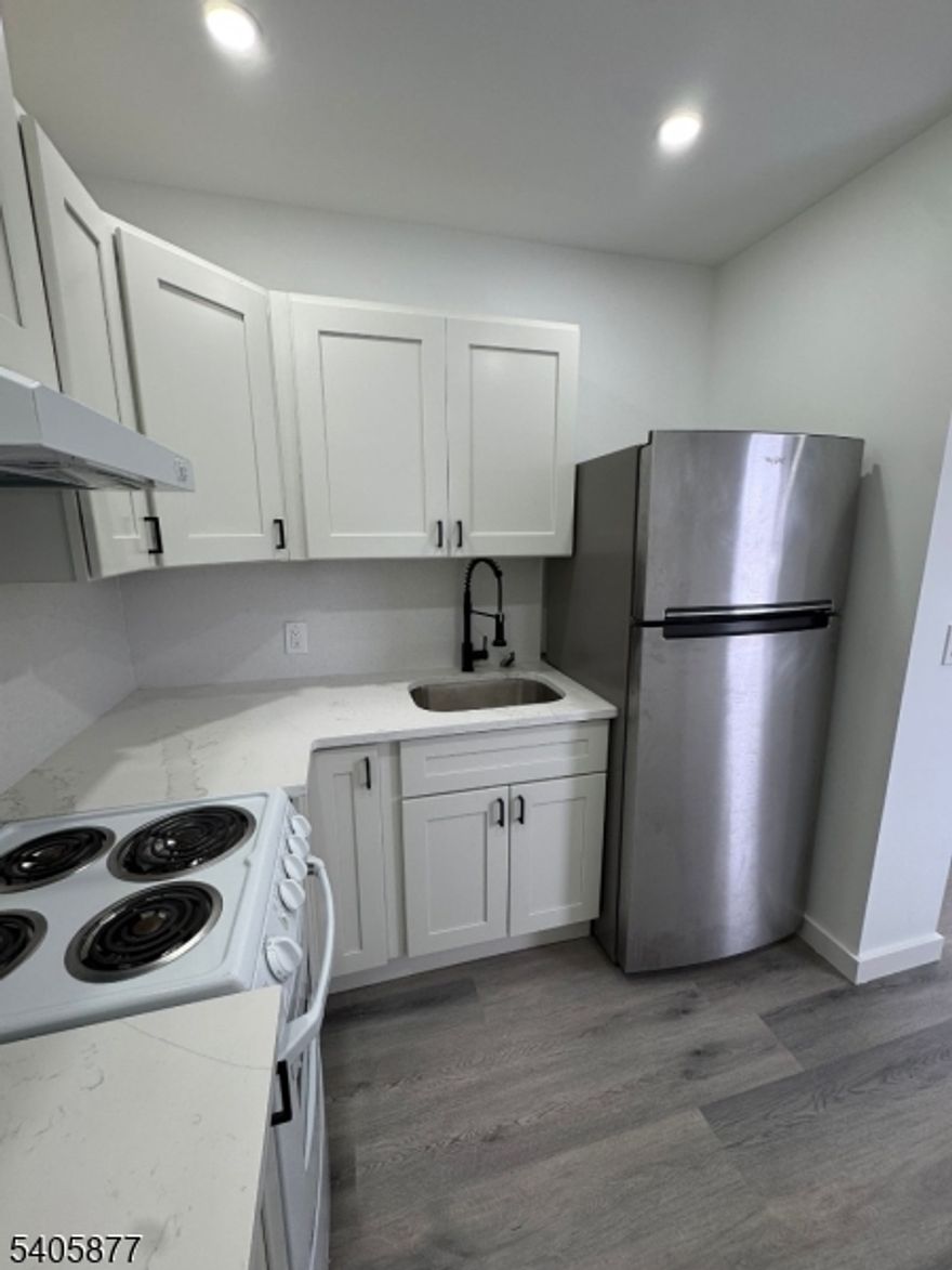 This fully renovated one-bedroom apartment is located on the second floor of a two-family house on Broughton Avenue in Bloomfield. The apartment has been transformed from top to bottom, featuring an inviting eat-in kitchen with new appliances and stunning quartz countertops. Laminate flooring has been newly installed throughout, and the interior has been freshly painted. The lighting has been revamped to create a warm ambiance, and there's plenty of closet space.The bathroom has been updated with new tiles, a toilet, and vanity. Brand new doors add to the apartment's charm. You'll also enjoy convenient parking and a prime location near transportation and shopping centers on Route... Plus, pets are welcome!