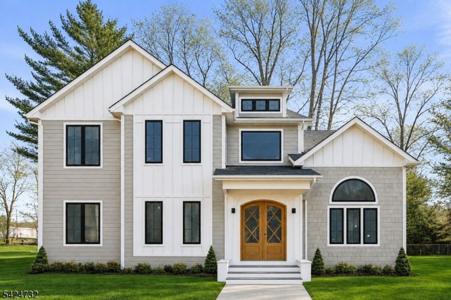 A masterclass in modern luxury, this exceptional NEW CONSTRUCTION Center Hall Colonial offers 6 bedrooms and 6.5 baths, set on a level 0.36-acre lot in one of Florham Park's most desirable neighborhoods. Spanning approx 6,200 sq ft across three beautifully finished levels, this residence blends timeless design with elevated finishes throughout. A custom luxury-grade entry door opens to a grand two-story foyer, flanked by formal living and dining rooms. The sun-drenched family room with stunning gas fireplace flows seamlessly into the chef's kitchen featuring premium panel-ready appliances, an expansive quartz island, quartz backsplash, walk-in pantry, bar area, and bright breakfast nook. Glass doors lead to a patio and spacious backyard for effortless indoor-outdoor living.The main level includes a private en-suite bedroom with WIC, dedicated home office, powder room with Carrara marble vanity, mudroom, and direct access to a 2-car garage. Upstairs, four en-suite bedrooms include a luxurious primary suite with dual WICs, sitting area, and spa-like bath, plus a convenient laundry room.The finished lower level offers a rec room, media lounge, office, bedroom, and full bath. Custom millwork, designer lighting, and a 10-year New Construction Warranty complete this exceptional home, ideally located near highways, shopping, and dining.