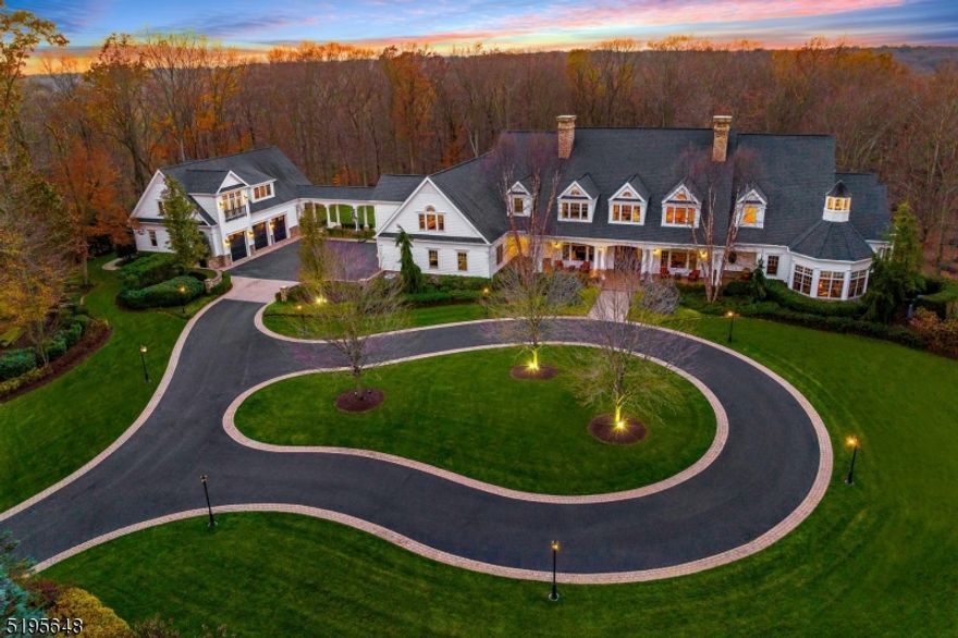 An opportunity for those seeking only the finest craftsmanship and a bespoke home with the most prestigious address in Monroe. Appointed on over 15 plush acres, seclusion and privacy welcome you through gated access. A builder's house, every detail carefully curated timeless appeal, constructed with cedar impressions, Azek trim, and oversized Pella architectural series windows. Upon entering the foyer painted with liquefied granite, you'll notice arch trim openings. The main level features a luxurious entertainment place with a full bar, gas fireplace, and a temperature-controlled wine room. The 2100 sq. primary suite and domed sitting area on the main level offers two oversized closets, one with its outdoor balcony,  spa-like bathroom & fireplace.     Separate apartment over detached four car garage including the entrance foyer is approx 1738 sq. that is included in the total sq footage and consists of a full kitchen, one bedroom, dining room, laundry room, living room, and separate finished den/office.